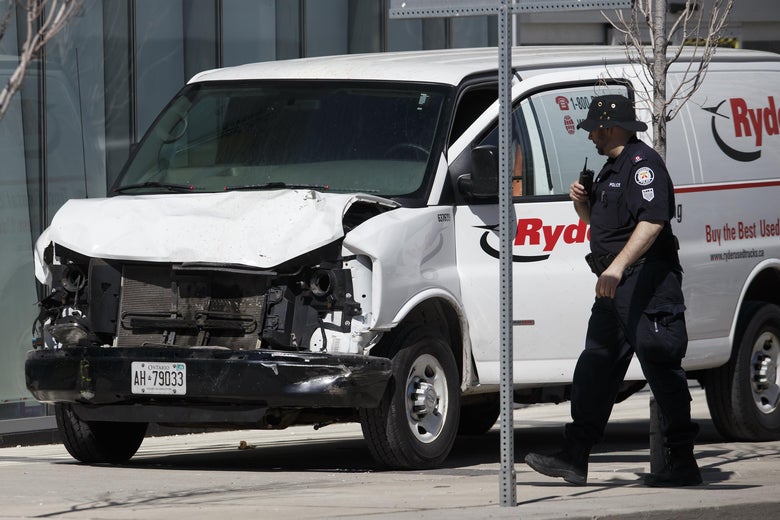 Police inspect a van suspected of being involved in a collision injuring at least eight people at Yonge St. and Finch Ave. on April 23, 2018 in Toronto, Canada.